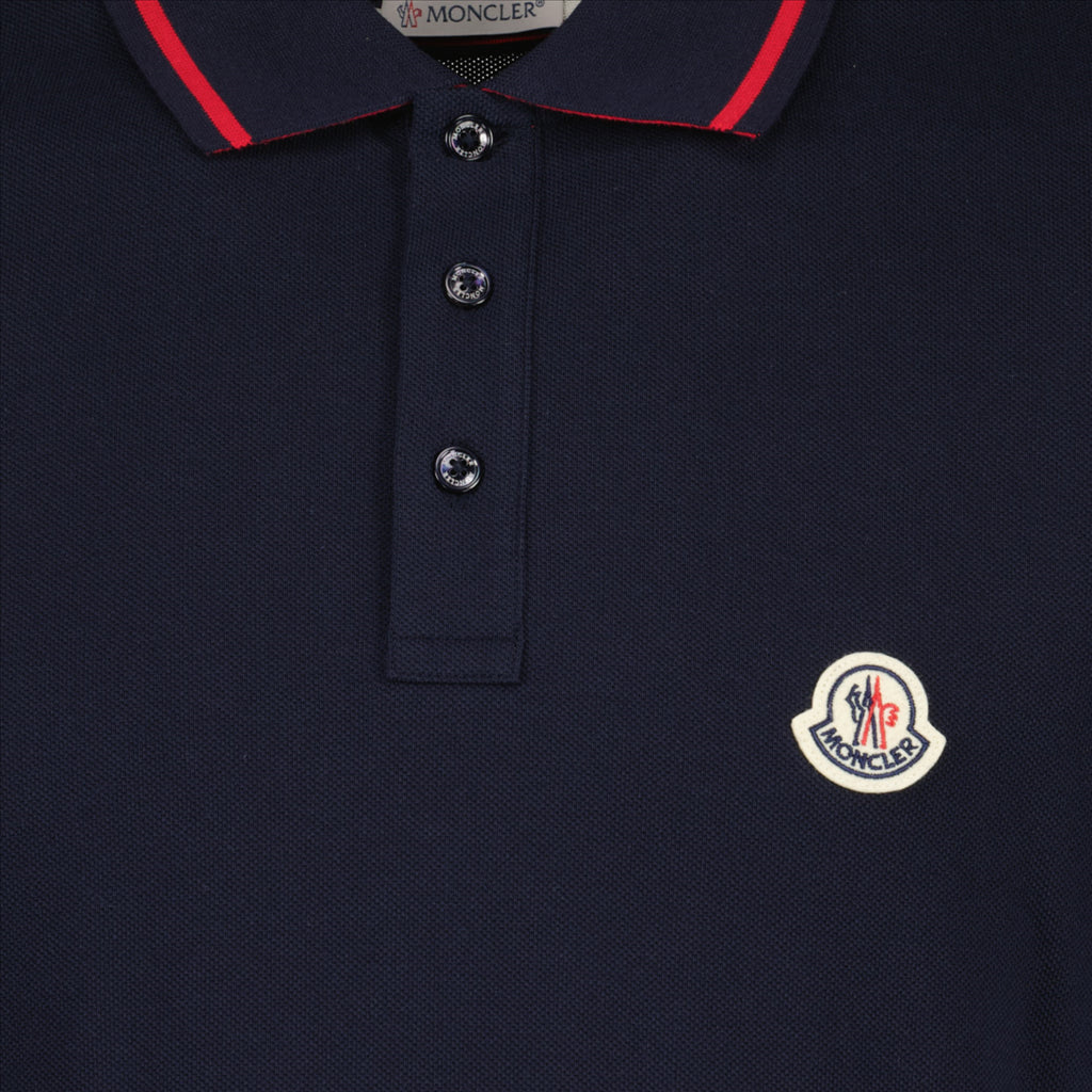 Polo shirt with logo and piping